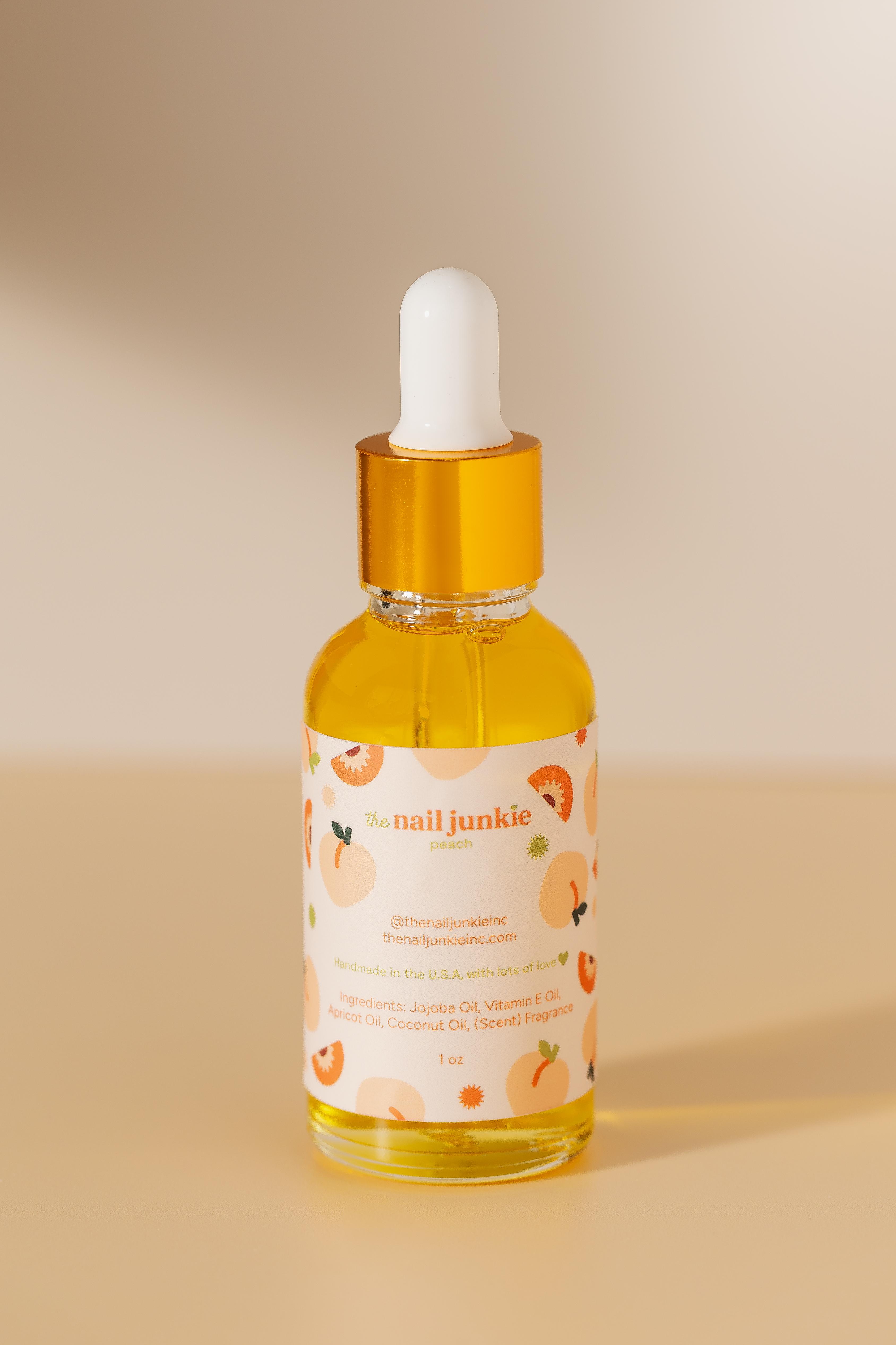 Peach scented cuticle oil bottle by The Nail Junkie