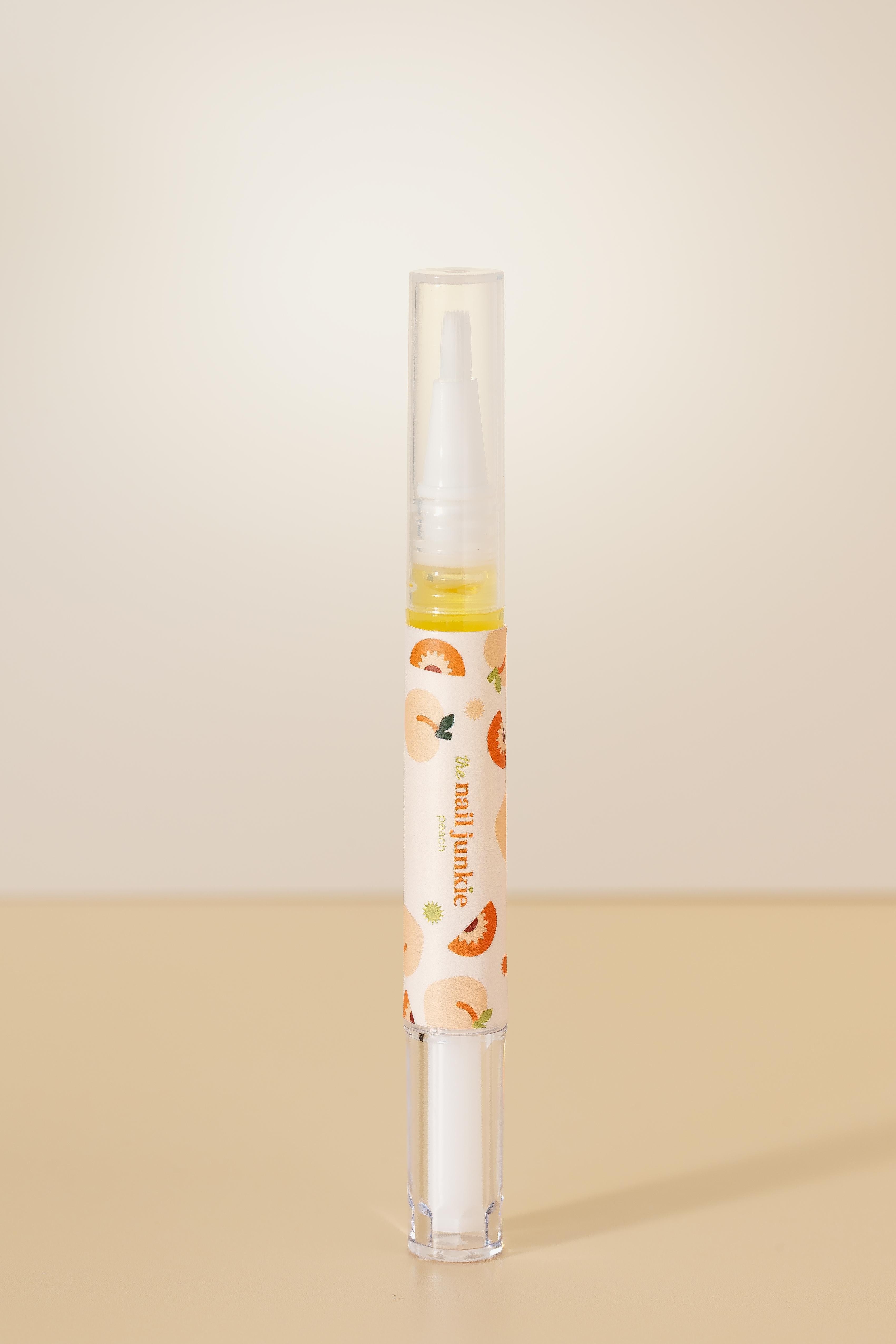 Peach scented cuticle oil pen by The Nail Junkie